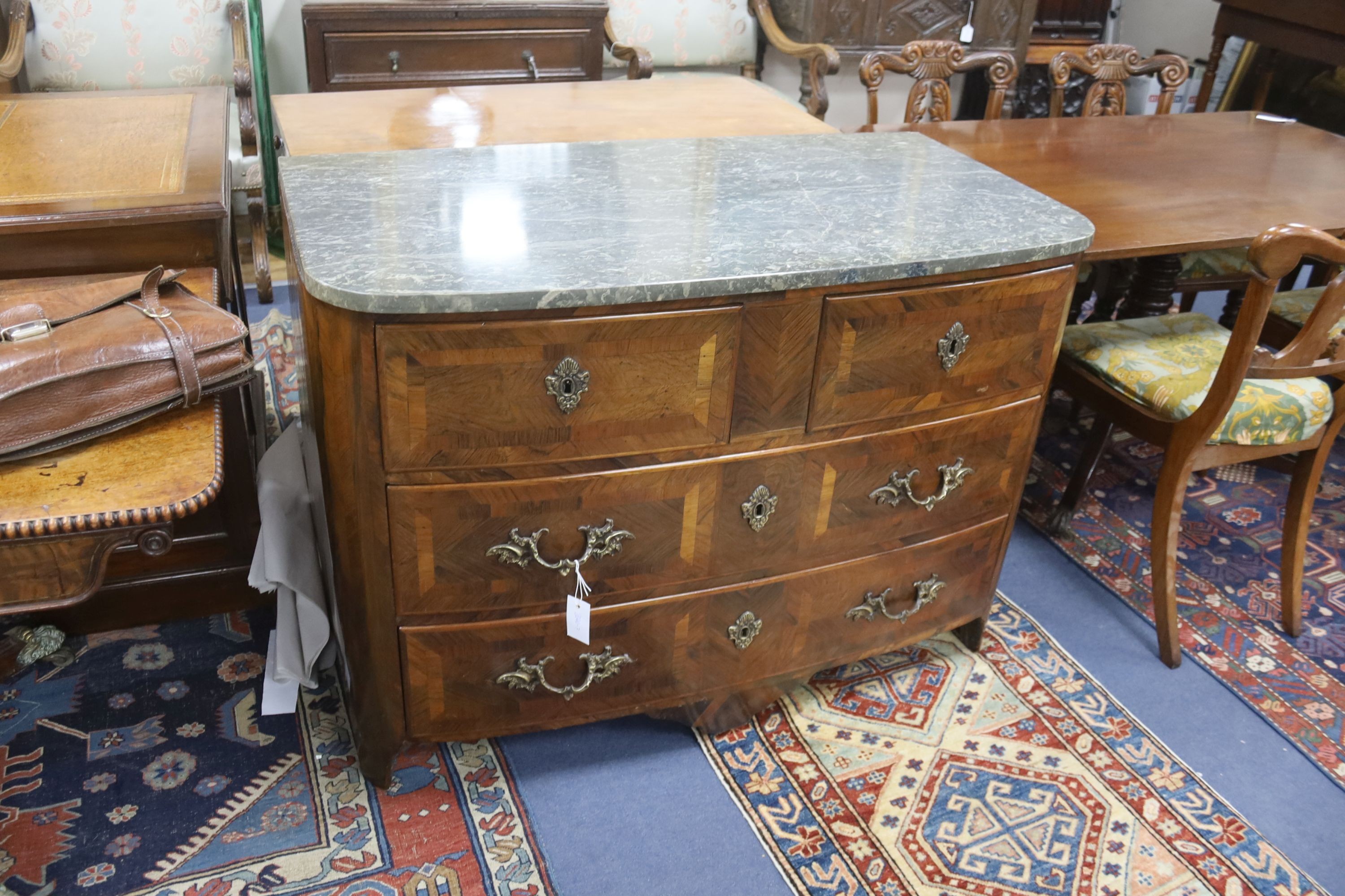 An 18th century French banded walnut marble topped bow front commode, width 112cm, depth 59cm, height 81cm